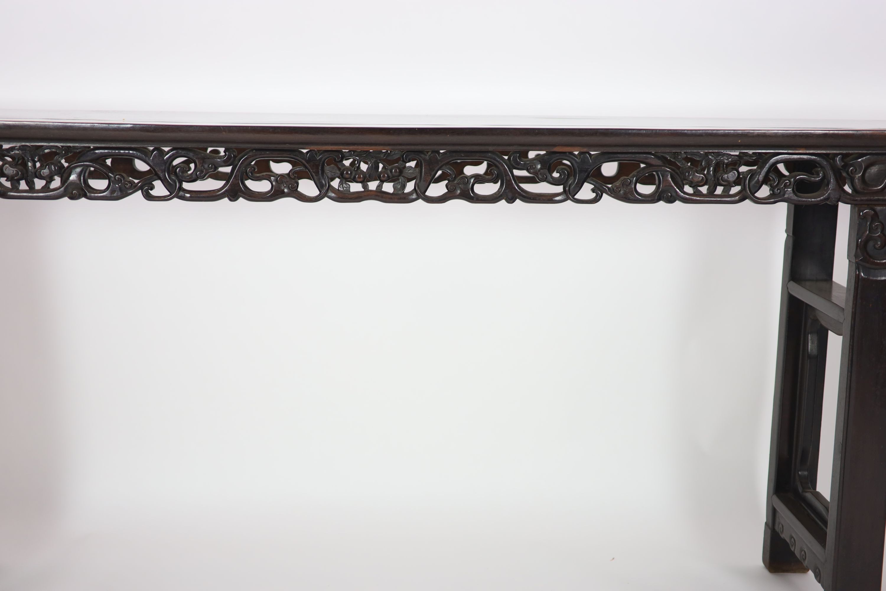 A large Chinese hongmu altar table, 19th century H 110cm. W 281cm. D 51.5cm.